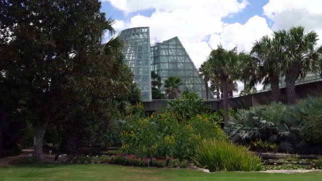 Low-Angle-Panning-and-Moving-Across-Video-of-Cone-Shape-Glass-Greenhouse