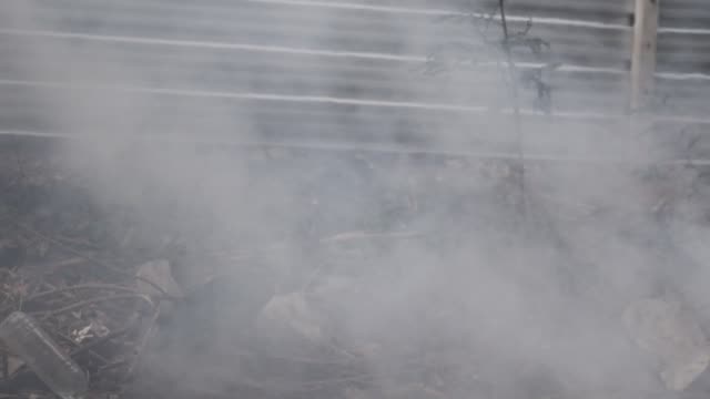 Gray-and-black-color-smoke-from-burning-sticks