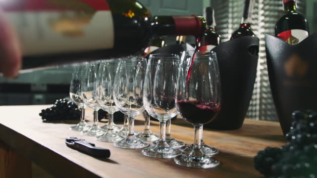 Pouring-wine-into-wineglasses-for-degustation