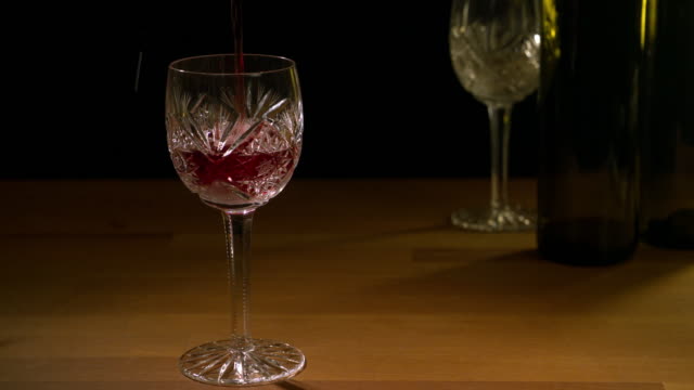 Red-wine-is-poured-into-a-glass