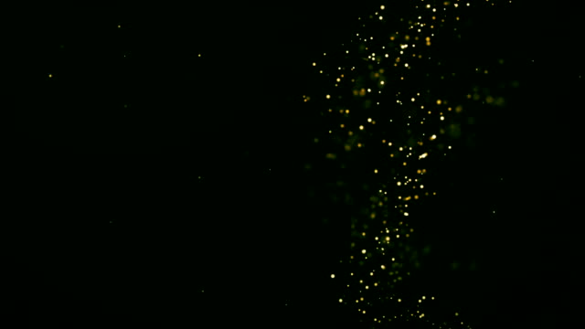 Movimiento-de-fondo-de-oro.-Polvo-de-oro-universo-con-estrellas-sobre-fondo-negro.-Resumen-de-movimiento-de-las-partículas.