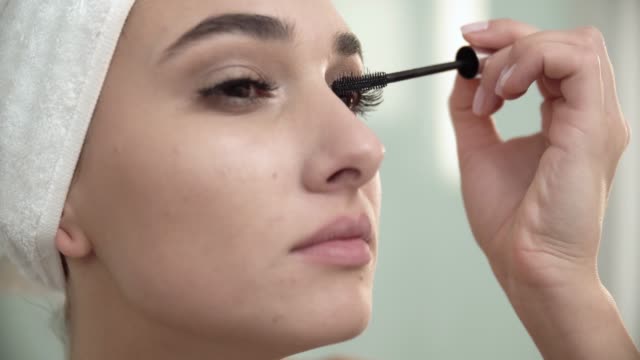 Makeup-At-Bathroom.-Woman-Applying-Mascara-On-Eyelashes