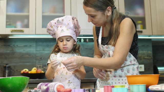 Mother-making-cookies-with-her-daughter