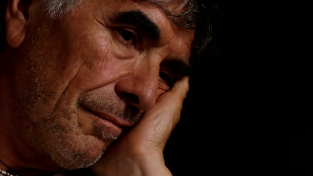 Daydreaming-and-sad-mature-man.-Close-up-portrait-of-pensive-man