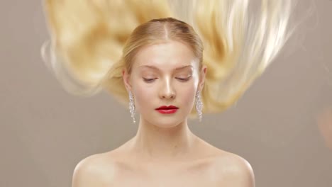 Gorgeous-blond-girl-with-falling-hair-in-slow-motion