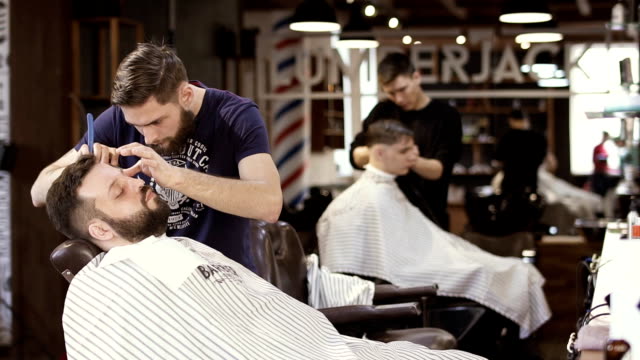 Professional-barbers-works-in-barbershop