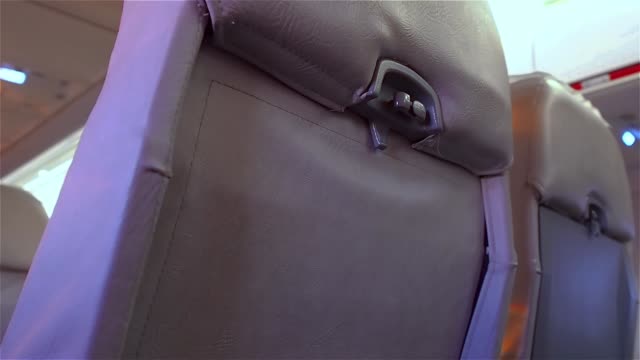 Closing-individual-cabin-seat-table.-Airplane-interior