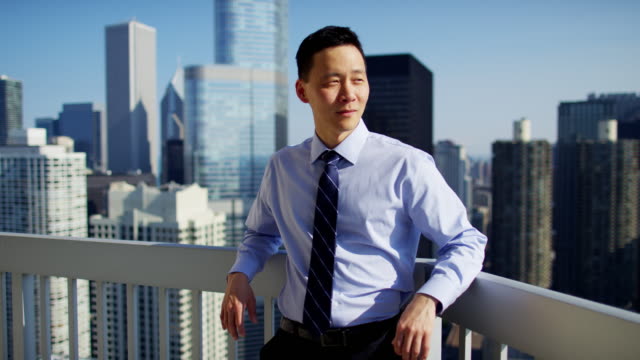 Portrait-of-Asian-business-executive-on-Chicago-rooftop