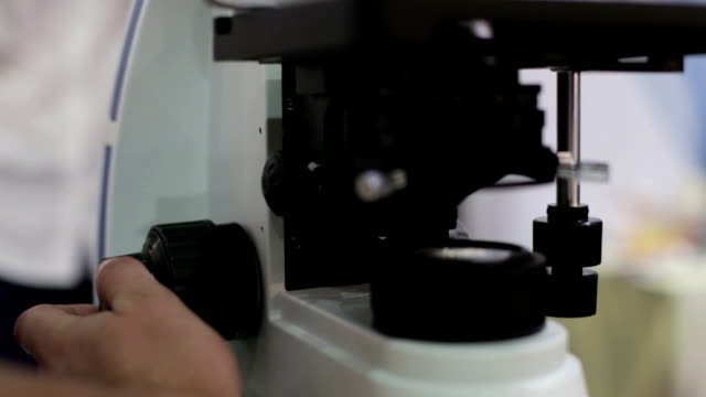 The-doctor-works-with-a-microscope