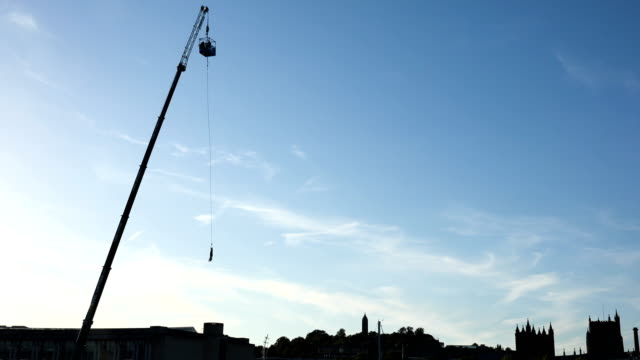 high-crane-working-at-sunset-in-port---Bristol,-UK