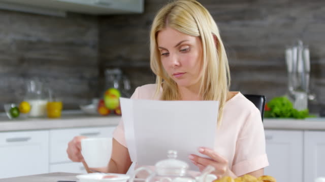 Caucasian-Woman-Working-with-Documents-from-Home