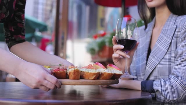 Food-And-Drink.-Closeup-Woman-Drinking-Wine-With-Snacks