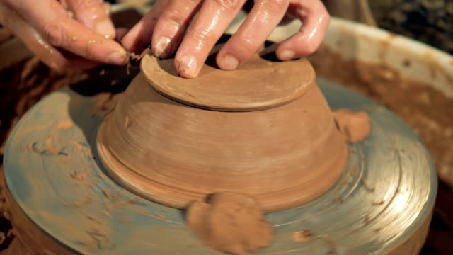 An-overturned-bowl-spins-on-a-potters-wheel-during-final-processing.