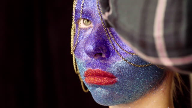 Face-art.-The-make-up-artist-decorating-hair