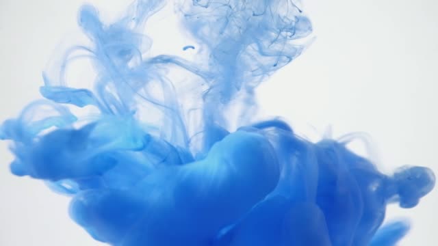 Close-up-blue-ink-being-poured-into-water.