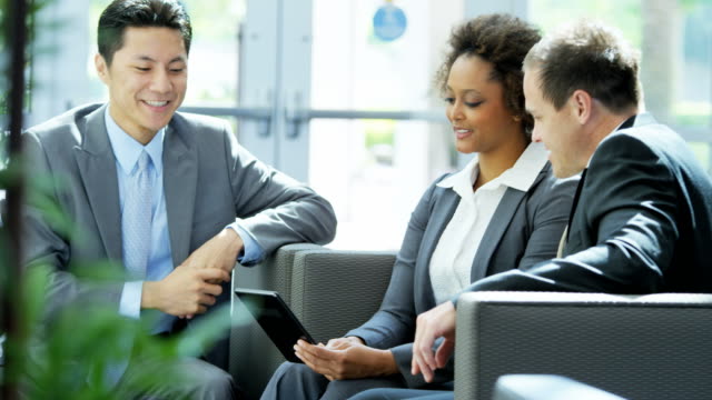 Multi-ethnic-male-female-business-people-in-meeting