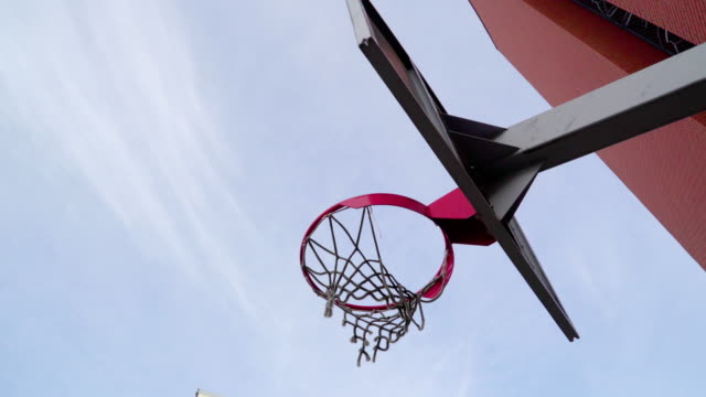 A-red-basketball-ring-on-the-basketball-court-outside