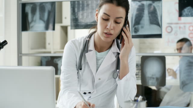 Busy-Female-Doctor-Talking-on-Phone