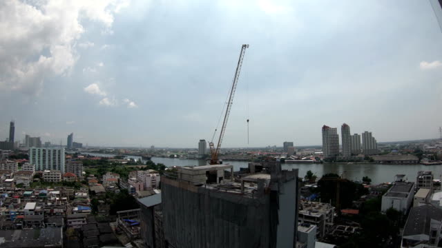 4K-Time-lapse-of-crane-working-in-construction-site