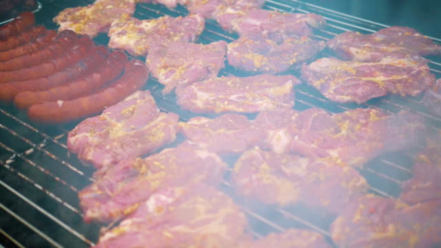 Sausages-and-pork-on-the-grill-in-slow-motion-180fps