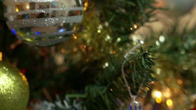 Christmas-Tree,-Hanging-Ornaments-tilt-shot.-4K.-UHD