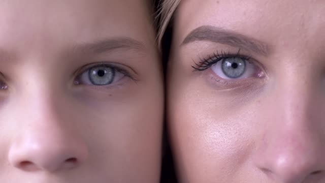 age-comparison,-eyes-of-caucasian-mother-and-daughter-next-to-one-another-looking-together-at-camera