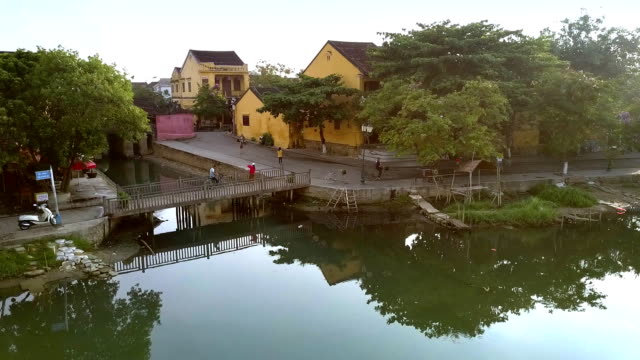 old-houses-on-waterfront-with-small-footbridge-in-Hoian