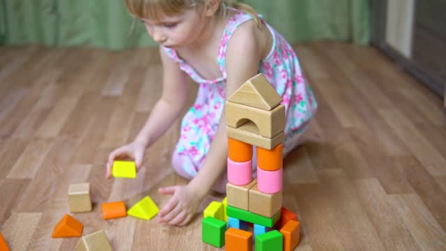 Little-girl-plays-with-a-designer.-4k
