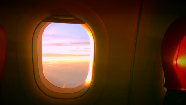 Cloud-Window-seat-airplane-concept.-Sky-cloud-view-from-Seat-airplane-close-up-window-on-sunset-beautiful.-It-sky-blue-or-azure-sky-and-cloud-over-land-in-daytime-beauty.
