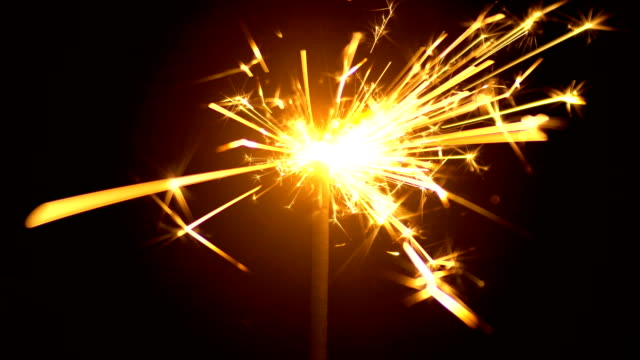 Yellow-Sparklers-is-Sparkling-On-Black-Background-4K