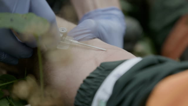 Putting-needle-into-arm