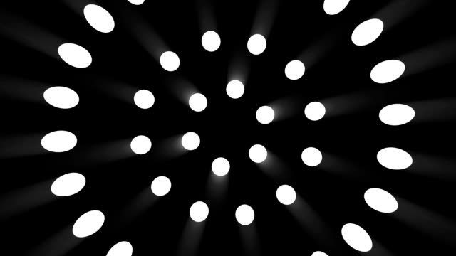 Animación-de-rotación-de-círculos-hechos-de-focos-sobre-fondo-negro.-Resumen-de-antecedentes-con-la-animación-de-círculos-de-rotación-y-con-los-rayos-de-luz-y-resplandor.-Animación-del-túnel-luz-abstracción