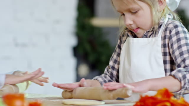 Girl-Trying-to-Roll-Out-Dough