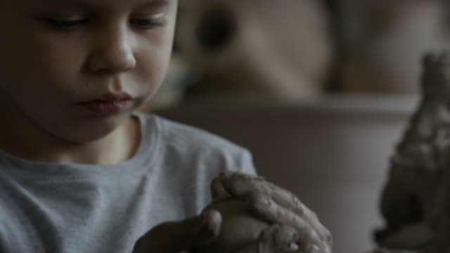 Little-Boy-Sculpting-with-Clay