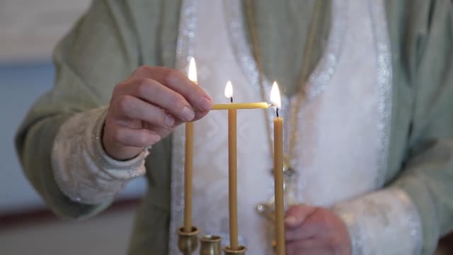 Monk-lighting-candle
