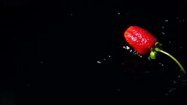 Falling-of-strawberry.-Slow-motion.
