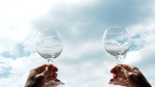 Wine-glasses-on-the-sky-background.
