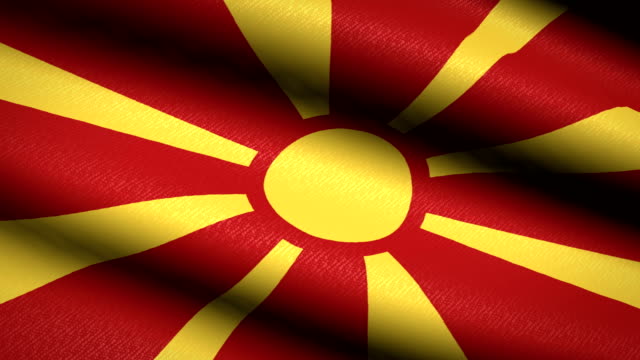 Mazedonien-Fahnenschwingen-Textile-strukturierten-Hintergrund.-Seamless-Loop-Animation.-Vollbild.-Slow-Motion.-4K-Video