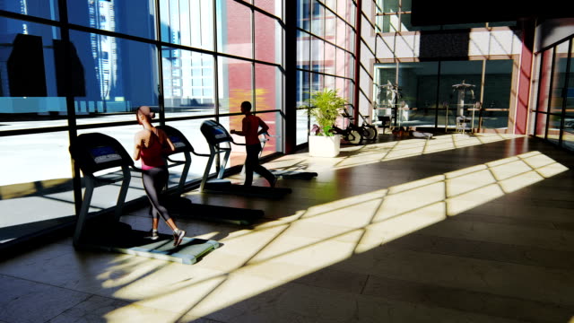 Gym-with-various-exercise-machines-in-it-and-people-walking-on-treadmill