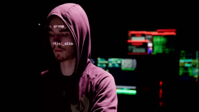 Close-up-on-a-man-with-a-hoodie-in-the-data-computer-room