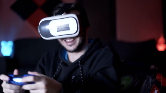 Young-man-playing-game-throwing-VR-glasses-and-controller-scared-from-the-game