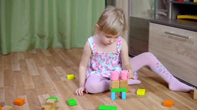 Little-girl-plays-with-a-designer.-4k