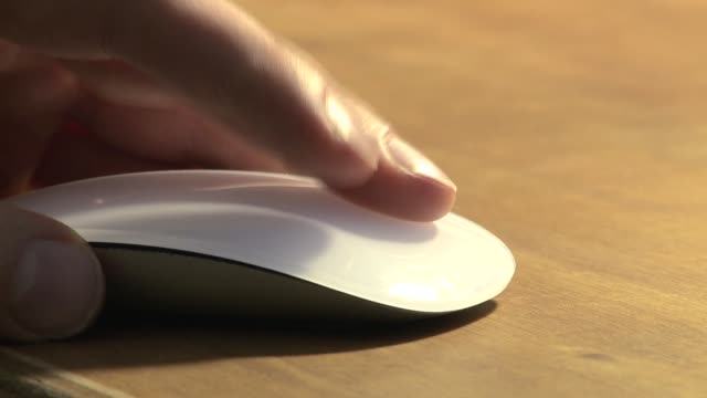 Static-shot-of-a-hand-moving-and-clicking-a-mouse