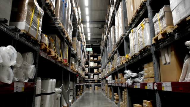 Warehouse-or-hangar-storage-racks-or-shelves-with-boxes-and-goods