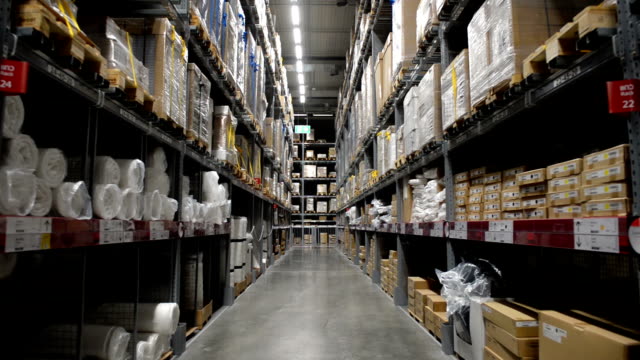 Moving-between-boxes-on-stock-shelf-in-warehouse