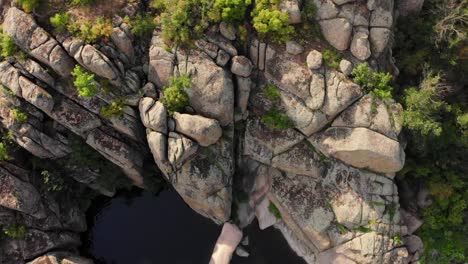 Aerial-view.-Flying-over-beautiful-canyon-in-wild-nature-landscape,-Drone-flies-at-summer-season.-The-river-flowing-between-the-rocks-to-descent-down
