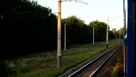 The-movement-of-the-train-at-a-sunset.