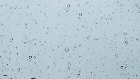 Heavy-rain-against-a-window,-tripod-footage.