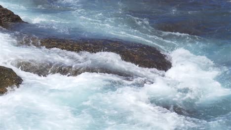 Foaming-and-splashing-wave-in-the-Ocean-with-slow-motion-style,-Sunny-Day-in-Chaojing-Park,-Keelung-City-Taiwan