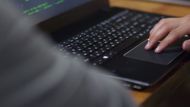 Man-Using-Laptop-Computer-Touchpad